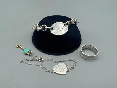 Lot of Tiffany & Co. Sterling Silver Bracelet, Necklace, Ring, & Charms