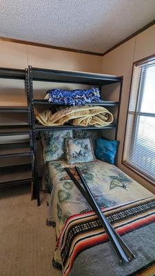 Metal Shelves and Twin Bed