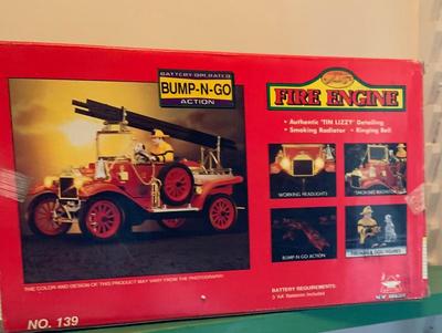 LOT:62G:  New Bright Bump and Go Toy Vehicles- The Locomotive & Fire Engine