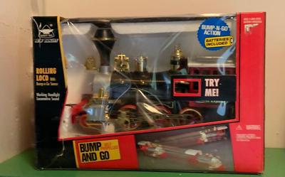 LOT:62G:  New Bright Bump and Go Toy Vehicles- The Locomotive & Fire Engine