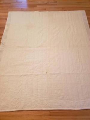 Vintage hand pieced machine quilted hexagon quilt.