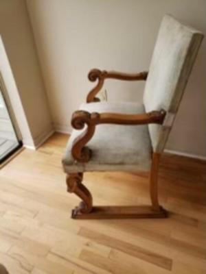 Antique Walnut carved fireside arm chair. Circa 1850.