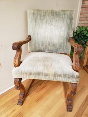 Antique Walnut carved fireside arm chair. Circa 1850.