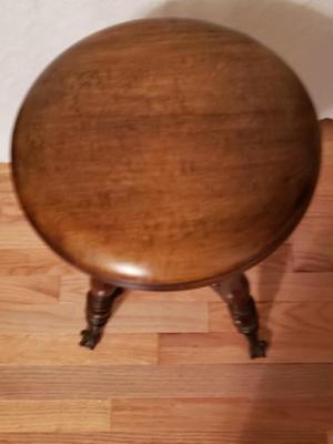 Antique piano stool with glass ball and claw feet