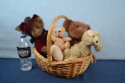 LOT 366. BASKET WITH FOUR BEARS