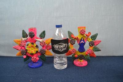 LOT 370. PAIR OF CLAY CANDLE HOLDERS