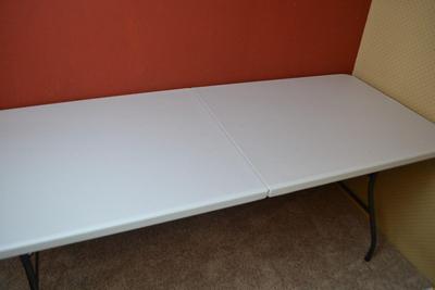 LOT 376. COSCO 6 FOOT FOLD IN HALF FOLDING TABLE