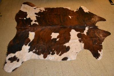 LOT 470. COWHIDE RUG