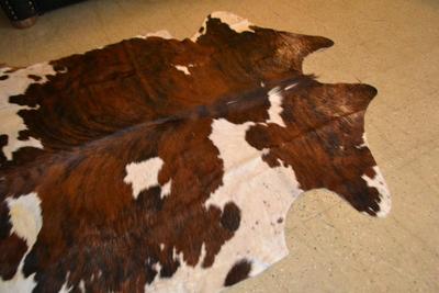 LOT 470. COWHIDE RUG