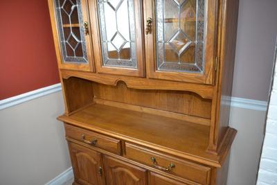 LOT 556. VINTAGE TWO PART HUTCH WITH LEAD GLASS CABINET DOORS