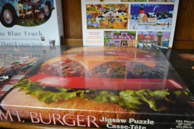 LOT 565. FOUR PUZZLES