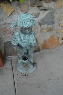 LOT 607.  GIRL WATER FIGURINE MADE OF METAL