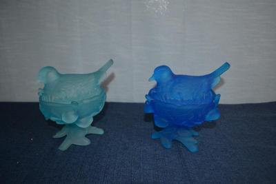 LOT 610. TWO GLASS COVERED BIRD SHAPED DISHES