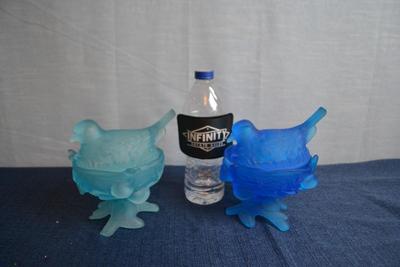LOT 610. TWO GLASS COVERED BIRD SHAPED DISHES