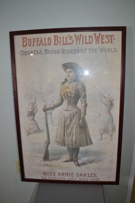 LOT 661.  FRAMED ANNIE OAKLEY POSTER.