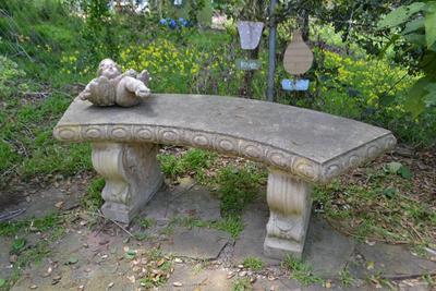 LOT 689. CONCRETE BENCH AND CONCRETE ANGEL