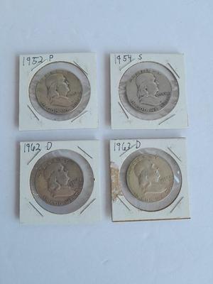 Four Franklin Half Dollar coins 1952P, 1954S, 1962D, and 1963D