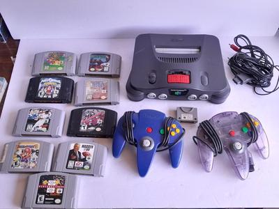 Nintendo 64 with controllers, Nine games, cords, and more