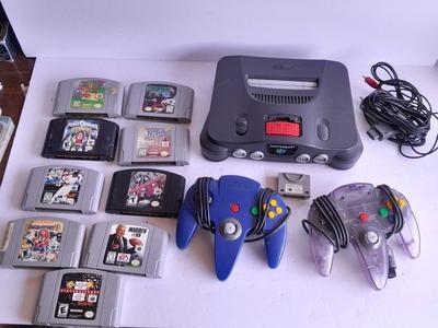 Nintendo 64 with controllers, Nine games, cords, and more