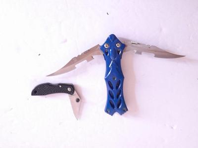 Two knives, double bladed and small black pocketknife