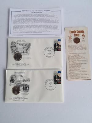 Two unopened 2004 United States Louisianna Purchase Five-Cent coins and a Lincoln - Kennedy Penny