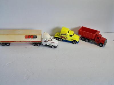 Two Semi Trucks one with trailer Road Champs, and Hot Wheels, and Hot Wheels Dump Truck
