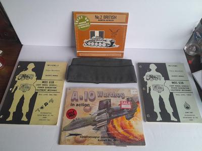 Military books, Field Guide booklets, and a Side cap