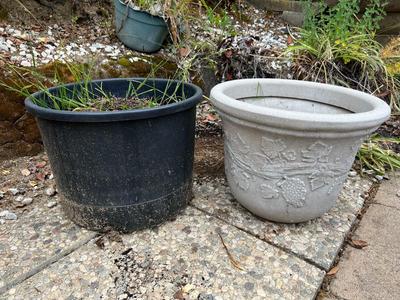 Pair of Plastic Pottery Planters Grape Leaf Design & Plain Black Pots