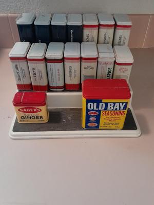 Nonskid Shelf organizer with metal cans of cooking spices