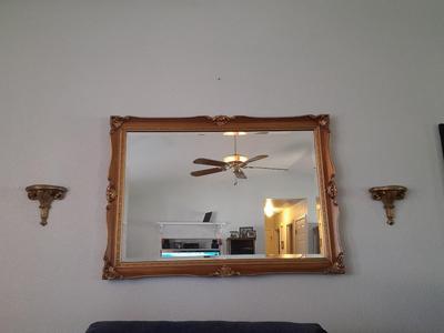 Large Gold framed beveled mirror with two MCM wall shelves.