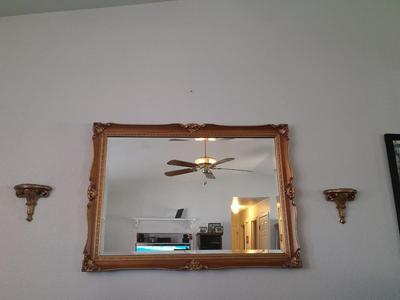 Large Gold framed beveled mirror with two MCM wall shelves.