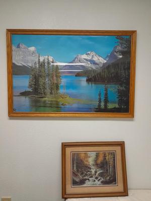 large mountain lake framed artwork and smaller waterfall picture