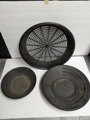 two gold pans and one strainer and a rock pic