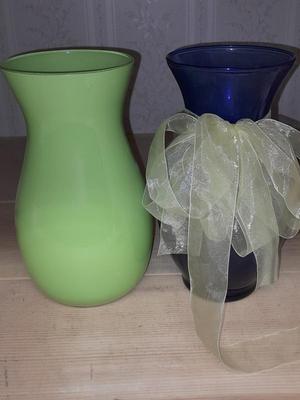 Two glass vases, one green, one blue
