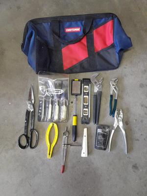 Soft sided Craftsman tool bag with an assortment of tools