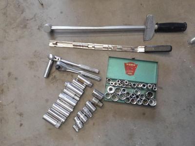 A bunch of different sockets and a torque wrench