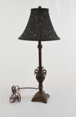 Bronze-look decorative table lamp with swirl patterned shade
