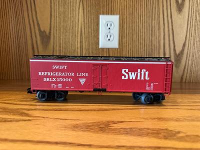 SMALL ANIMAL FIGURES AND A SWIFT TRAIN CAR