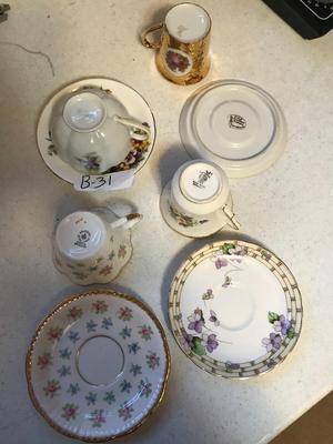 Four collectible teacup & saucers