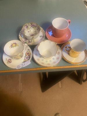 Four collectible teacup & saucers