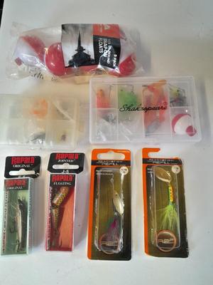 Assortment of Fishing lures new in boxes and other fishing tackle. Rapala Lures