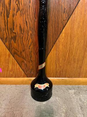 TALL SEALED BOTTLE OF WINE