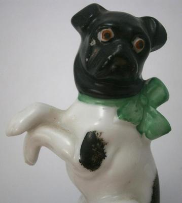 Antique Bull Dog with Bow Sitting on Cushion