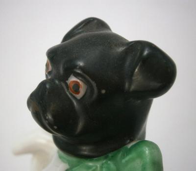 Antique Bull Dog with Bow Sitting on Cushion