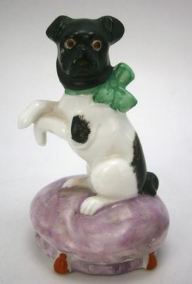Antique Bull Dog with Bow Sitting on Cushion