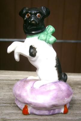 Antique Bull Dog with Bow Sitting on Cushion
