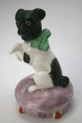 Antique Bull Dog with Bow Sitting on Cushion