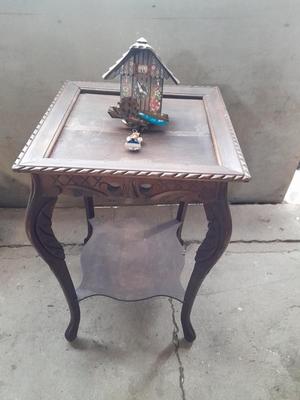 Antique wooden two-tiered table with faux clock music box