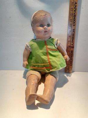Very old and well-loved composition and cloth baby doll