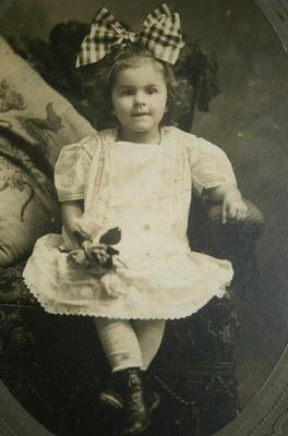 Early Image of young Girl with Roses